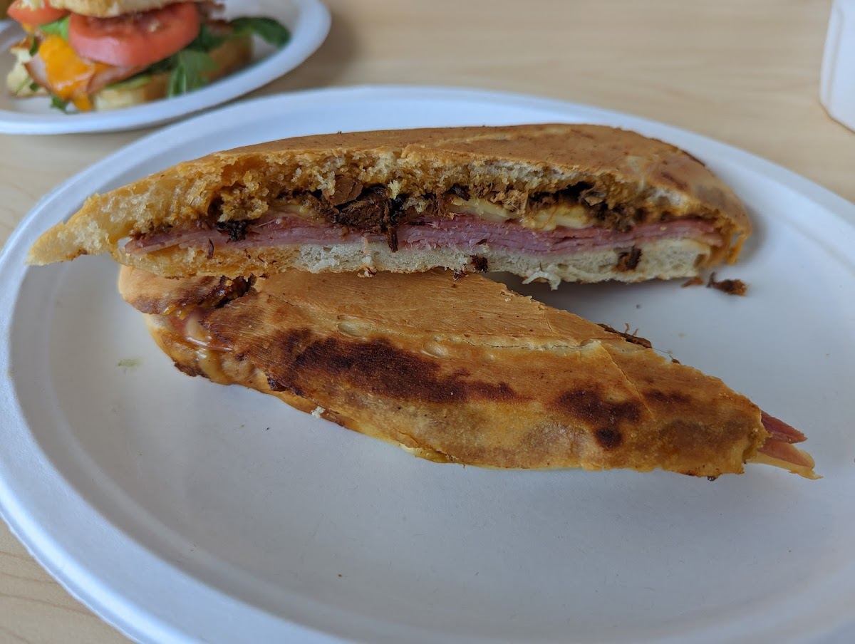 A pressed Tampa Cuban sandwich cut in half