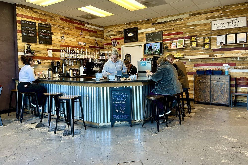 Inside Wildflour Bistro: the corrugated steel counter, wood walls and a few tables